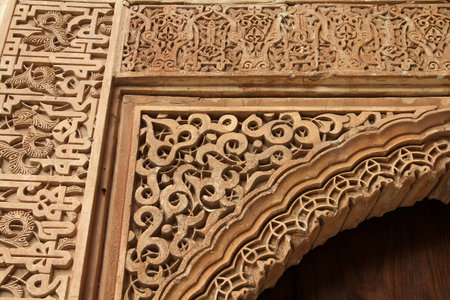 Alhambra in Granada - Moorish palace complex in Andalusia, Spain. Intricate floral stonework decors.