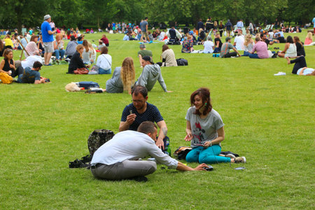 LONDON, UK - JULY 9, 2016: People enjoy summer in Green Park in London. Green Park is one of the Royal Parks of London.のeditorial素材