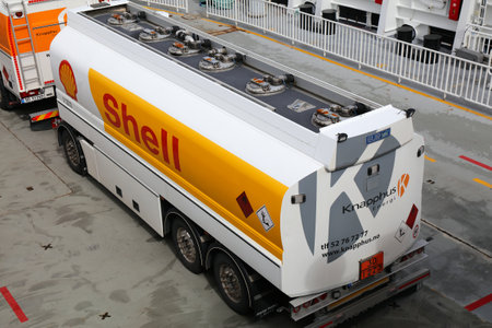 BOKNAFJORD, NORWAY - JULY 23, 2020: Shell brand tanker truck transported on a car ferry crosses...