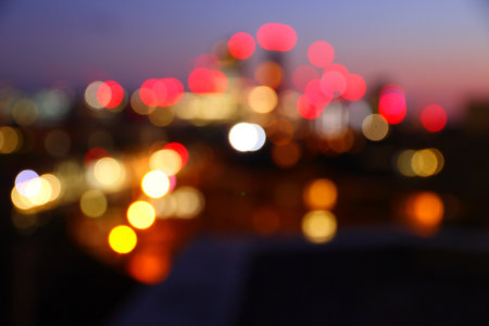 Big city night lights - defocused evening skyline of London UK. Blurry cityscape.の写真素材