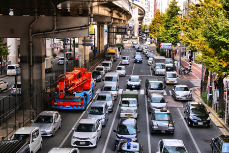 OSAKA, JAPAN - NOVEMBER 22, 2016: People drive in traffic in Osaka, Japan. Osaka belongs to 2nd largest metropolitan area of Japan (19.3 million people).のeditorial素材