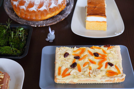 Easter cakes table in Poland. Easter pastry: mazurek cake decorated with almonds and apricot. Easter...