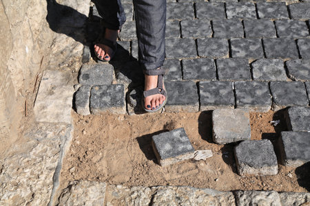 Pedestrian safety problem. City sidewalk damage. Dangerous city sidewalk, injury hazard. Tel Aviv city, Israel.の写真素材
