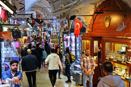 ISTANBUL, TURKEY - MARCH 25, 2023: People visit Grand Bazaar in Istanbul, Turkey. The Grand Bazaar...
