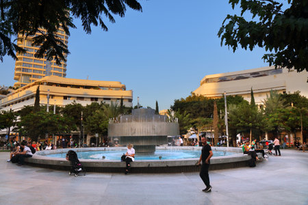 TEL AVIV, ISRAEL - NOVEMBER 3, 2022: People visit famous Dizengoff Square in Tel Aviv, Israel. Tel Aviv White City and its bauhaus buildings are a UNESCO World Heritage Site.のeditorial素材