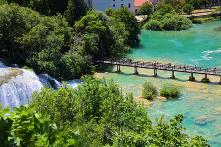 Krka waterfalls and tourist path bridge. Krka National Park in Croatia. Landscape of Croatia.の写真素材
