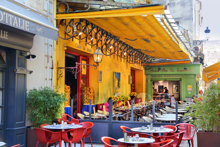 ARLES, FRANCE - OCTOBER 1, 2021: People visit Cafe Van Gogh in Arles, France. Many Vincent Van Gogh's paintings feature Arles town and this very cafe.のeditorial素材
