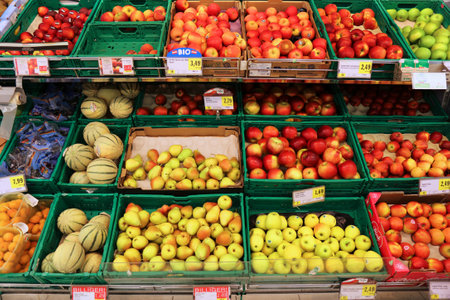 VIENNA, AUSTRIA - AUGUST 4, 2022: People visit fruit section in Spar supermarket in Austria. Spar is a large supermarket chain originating from the Netherlands.のeditorial素材
