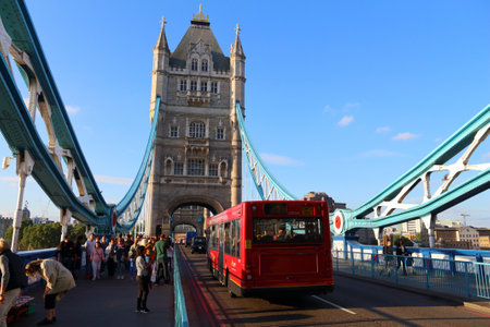 LONDON, UK - JULY 8, 2016: People ride a city bus on Tower Bridge, London, UK. Transport for London (TFL) operates 8,000 buses on 673 routes.のeditorial素材