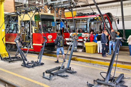 BYTOM, POLAND - SEPTEMBER 22, 2018: People visit tram depot of Tramwaje Slaskie public transportation company in Bytom, Poland.のeditorial素材