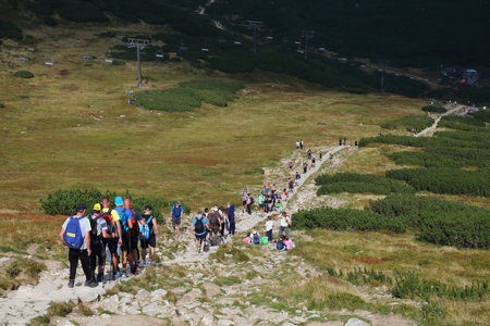 TATRA MOUNTAINS, POLAND - SEPTEMBER 9, 2023: Tourists hike the yellow trail in Dolina Gasienicowa valley in Tatrzanski Park Narodowy (Tatra National Park) in Poland.のeditorial素材