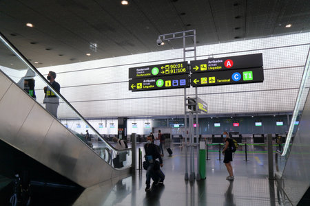 BARCELONA, SPAIN - OCTOBER 8, 2021: Trilingual signs in Spanish, English and Catalan language in Barcelona Airport in Spain. Barcelona is one of busiest airports in Spain and Europe.のeditorial素材