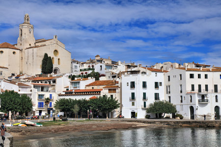 CADAQUES, SPAIN - OCTOBER 5, 2021: People visit picturesque fishing harbor of Cadaques in Catalonia region of Spain. The town is located in Alt Emporda county of Catalonia, Spain.のeditorial素材