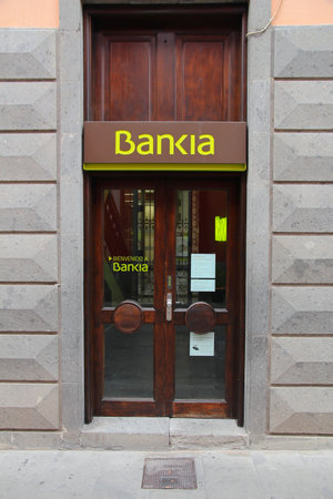 ARUCAS, SPAIN - NOVEMBER 29, 2015: Bankia bank branch in Arucas, Spain. Bankia is a Spanish bank conglomerate, the fourth largest bank of Spain with 12 million customers (2012).のeditorial素材
