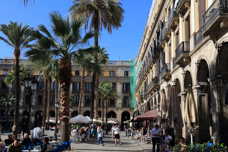BARCELONA, SPAIN - OCTOBER 7, 2021: People visit  Placa Reial square in Barri Gotic district of Barcelona, Spain. Barcelona is the 2nd largest city of Spain.のeditorial素材