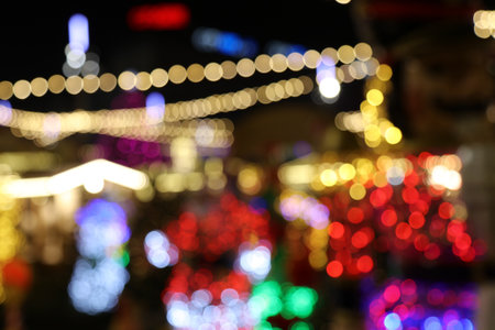 Defocused Christmas lights by night at Christmas market in Katowice, Poland.の写真素材