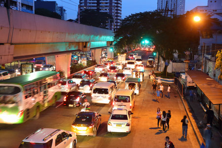 MANILA, PHILIPPINES - NOVEMBER 25, 2017: People drive in heavy traffic in Manila, Philippines. Metro...