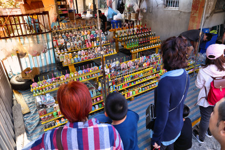 LUKANG, TAIWAN - DECEMBER 2, 2018: Visitors try to win small prizes in a game of chance in Lukang,...