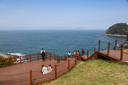 GEOJE, SOUTH KOREA - APRIL 1, 2023: Tourists visit viewpoints on Windy Hill, tourist attractions in Geoje island in Gyeongsangnam-do region of South Korea.のeditorial素材