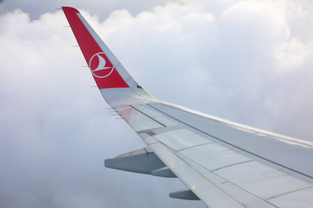 ISTANBUL, TURKEY - APRIL 11, 2023: Window view of Turkish Airlines aircraft wing.のeditorial素材