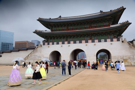 SEOUL, SOUTH KOREA - APRIL 6, 2023: People in traditional hanbok Korean costume visit Gyeongbokgung Palace in Seoul.のeditorial素材