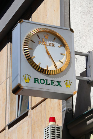 ERLANGEN, GERMANY - MAY 6, 2018: Public street clock promoting luxury brand Rolex in Erlangen, Germany.のeditorial素材