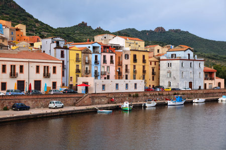 Bosa townscape - Italian town in Sardinia island (Oristano Province). Rainy dark clouds weather.の写真素材