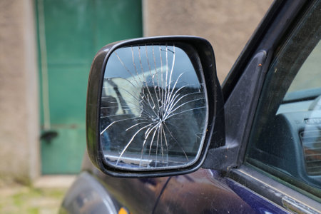 Broken side mirror of a generic car in Italy. Car damage.の写真素材