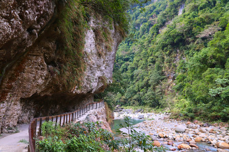 Taroko National Park in Taiwan. Shakadang hiking trail path cut out in rock cliff. Outdoors of Taiwan.の写真素材