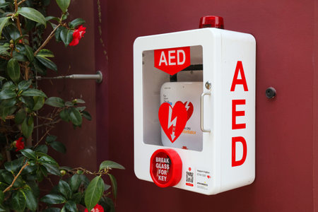 SINGAPORE CITY, SINGAPORE - MARCH 12, 2024: Automated External Defibrillator AED unit - medical emergency equipment in a public building in Singapore.のeditorial素材