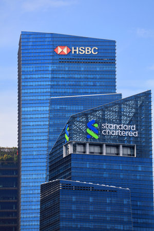 SINGAPORE CITY, SINGAPORE - MARCH 12, 2024: HSBC Bank and Standard Chartered bank office building in...