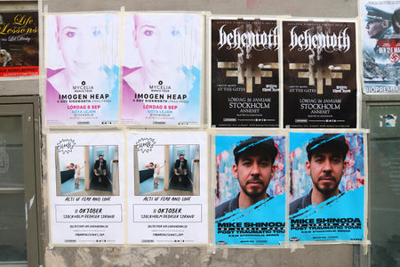 STOCKHOLM, SWEDEN - AUGUST 23, 2018: Posters for concerts and other events on a wall in Sodermalm district of Stockholm, Sweden.のeditorial素材
