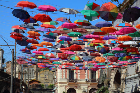 CATANIA, ITALY - AUGUST 2, 2024: Colorful umbrellas tourist attraction in Catania city on Sicily island, Italy.のeditorial素材