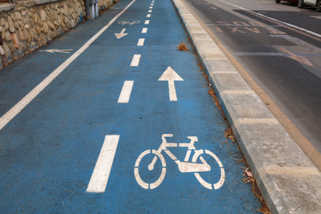 Syracuse city in Italy. Bicycle lane road marking next to separate bus lane.の写真素材