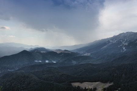 Clouds over Piatra Craiului mountains in Romania. Summer landscape of Piatra Craiului National Park.の写真素材