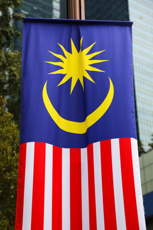 Flag of Malaysia. National flag in the city, vertical hanging version.の写真素材