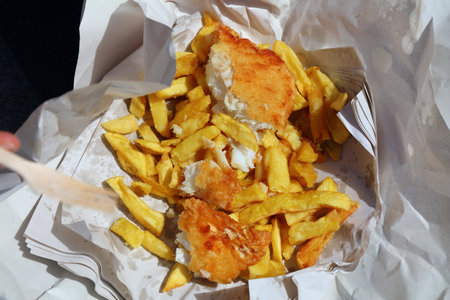 Fish and chips served in paper in Dublin, Ireland. Classic Irish food.