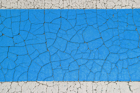 Cracked peeling paint background. White frame border and blue weathered surface. Blank copyspace grunge banner.の写真素材