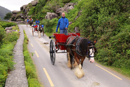 GAP OF DUNLOE, IRELAND - JULY 3, 2024: Drivers of Gap of Dunloe jaunting car tours in Ireland.のeditorial素材