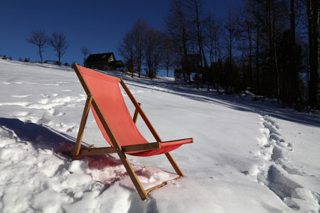 Winter in Poland - Beskidy mountains snowy relax on a sun chair.の写真素材