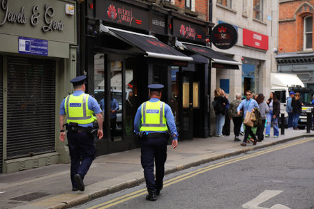 DUBLIN, IRELAND - JULY 5, 2024: Garda (Irish police) officers foot patrol in downtown Dublin.