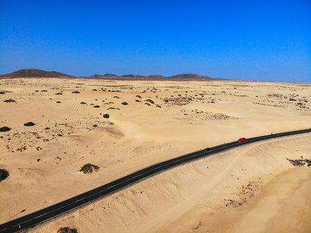 Corralejo sand dunes road in Fuerteventura island of Canary Islands, Spain.の写真素材