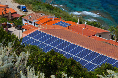 Solar energy in Italy. Rooftop photovoltaic panels in Castelsardo in Sardinia island, Italy.