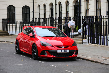 LONDON, UK - JULY 8, 2024: Red sporty Opel Corsa (Vauxhall Corsa) with tuning parked in London, UK.のeditorial素材