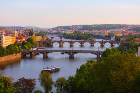 Prague city view with bridges over Vltava river. Sunset light. Cityscapes of Prague, Czech Republic.