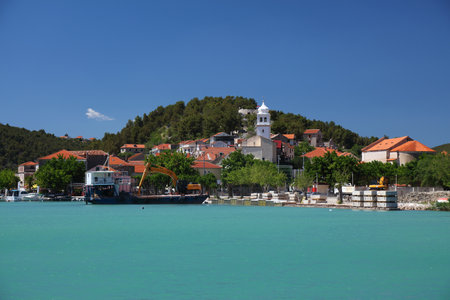 Skradin town in Croatia. Krka river waterfront townscape.