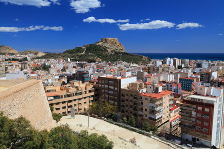 Alicante city in Valencian Community (Comunidad Valenciana), Spain. Sunny weather view with Santa Barbara Castle (background) and San Fernando Castle (foreground).の写真素材