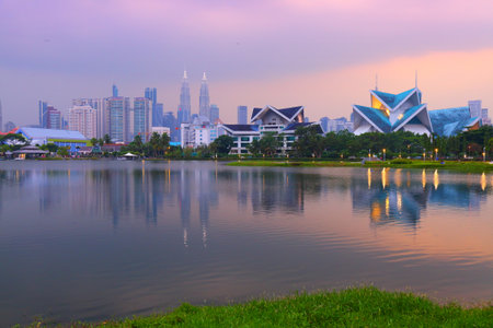 Kuala Lumpur city skyline in sunset light seen from Lake Titiwangsa. Kuala Lumpur, Malaysia.