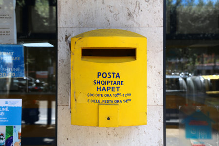 TIRANA, ALBANIA - JULY 10, 2025: Public mailbox of Posta Shqiptare, national public postal service in Tirana city, Albania.のeditorial素材