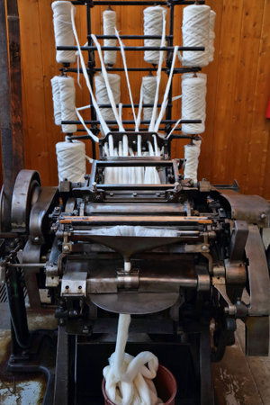 Textile factory machinery. Old comber machine for smooth fine yarn production. Historic textile...